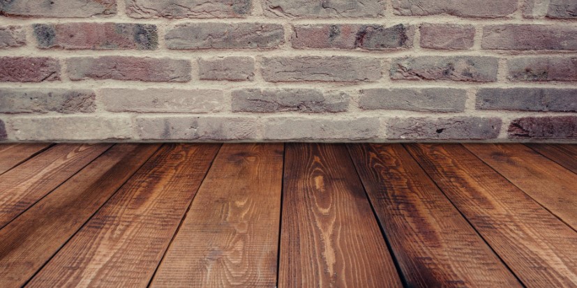 brick wall and wood floorboards